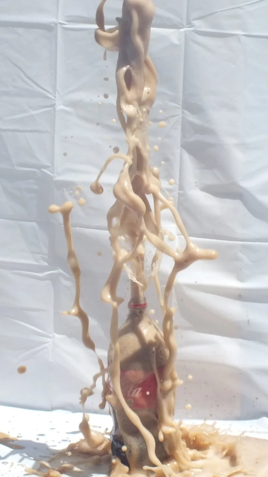 Soda Geyser: Soda and Mentos, frozen mid-air.